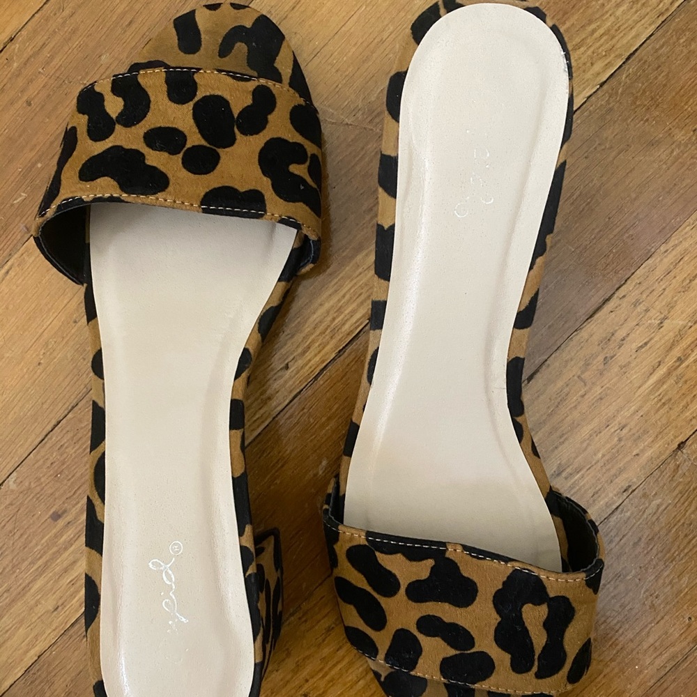 Super cute animal print slides with a block heel!